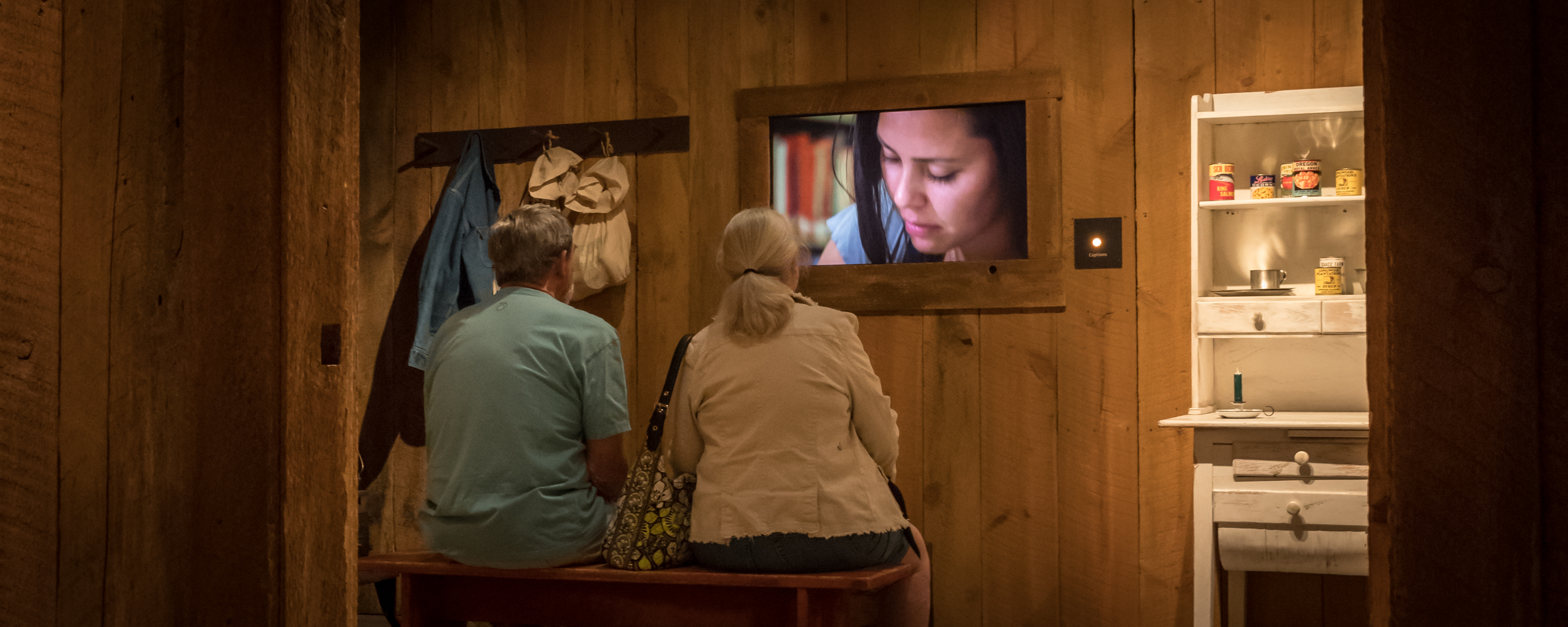 image of couple sitting watching tv