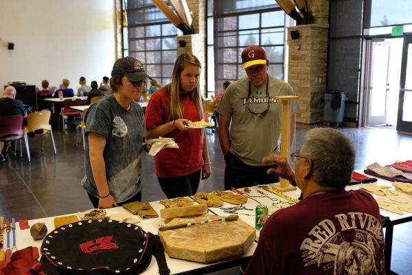 image of people gathering around table